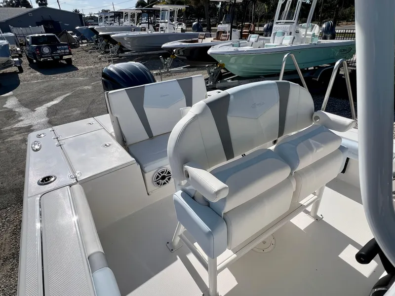 Slide: The Image of 2024 Robalo 246 Cayman boat interior with seating and storage compartments. - 10