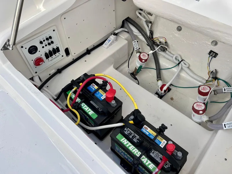 Slide: The Image of Electrical system and battery compartment of 2024 Robalo 246 Cayman boat. - 17