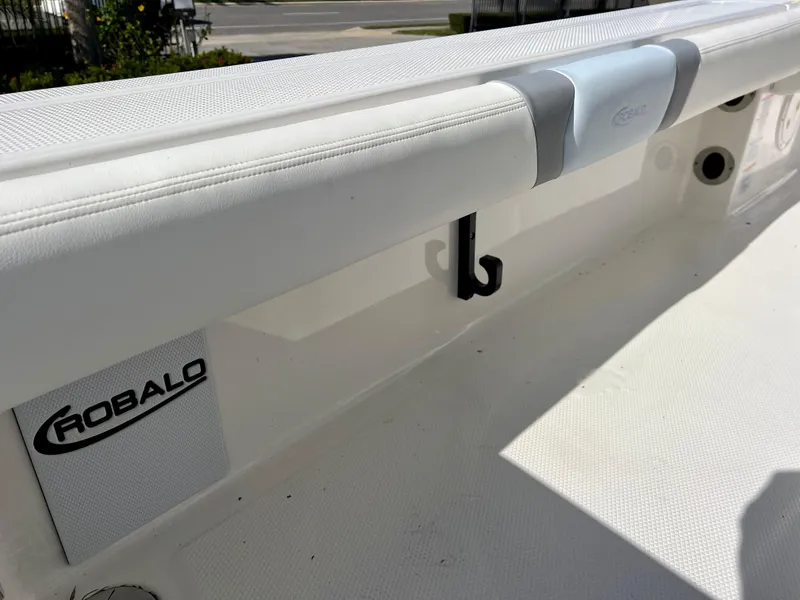 Slide: The Image of 2024 Robalo 246 Cayman boat interior detail with logo and hook. - 19