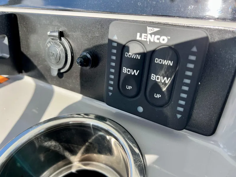 Slide: The Image of Close-up of Lenco trim tab controls on 2024 Robalo 246 Cayman boat. - 25