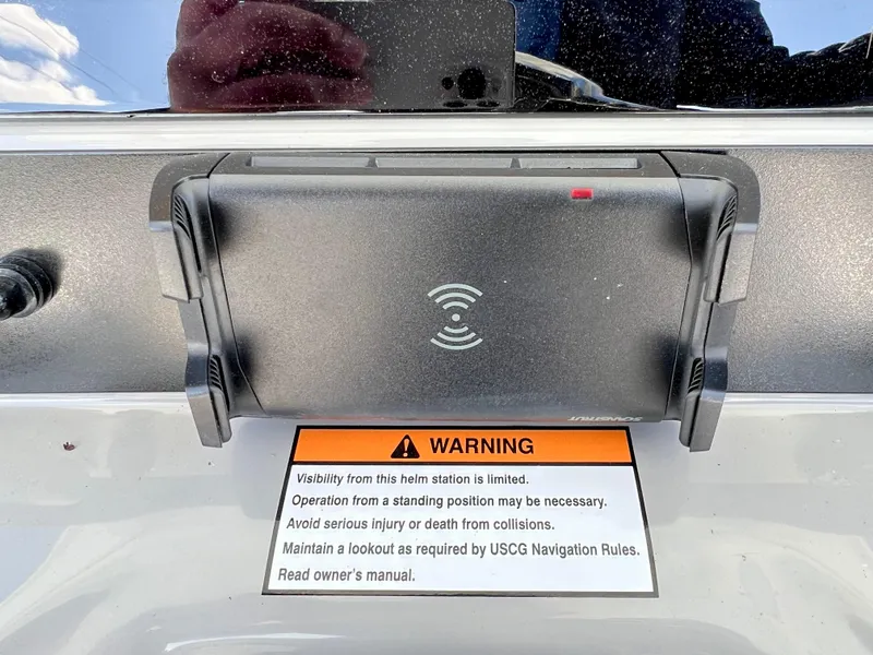 Slide: The Image of Warning label and device on 2024 Robalo 246 Cayman boat helm station. - 27
