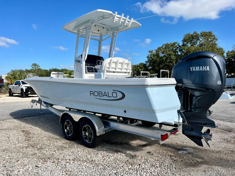 Slide: The Image of 2024 Robalo 246 Cayman boat with Yamaha engine on trailer. - 3