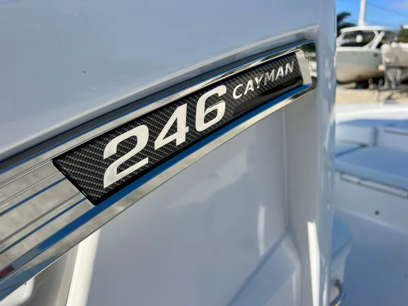 Slide: The Image of Close-up of 2024 Robalo 246 Cayman boat model nameplate. - 37