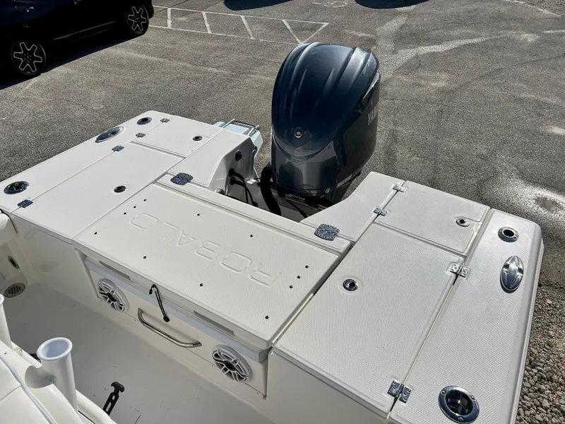 Slide: The Image of 2024 Robalo 246 Cayman boat with Yamaha outboard motor, rear deck view. - 8