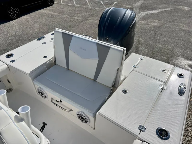Slide: The Image of 2024 Robalo 246 Cayman boat interior with seating and storage compartments. - 9