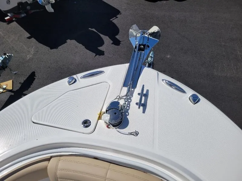 Slide: The Image of 2024 Edgewater 245 CC boat bow with anchor and deck details. - 16