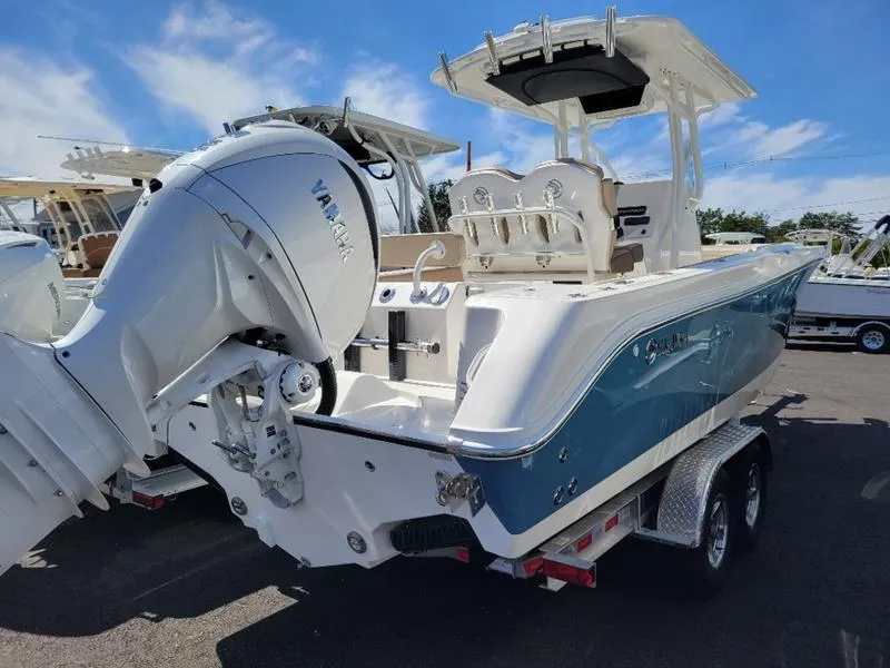 Slide: The Image of 2024 Edgewater 245 CC boat with Yamaha outboard engine on trailer. - 3