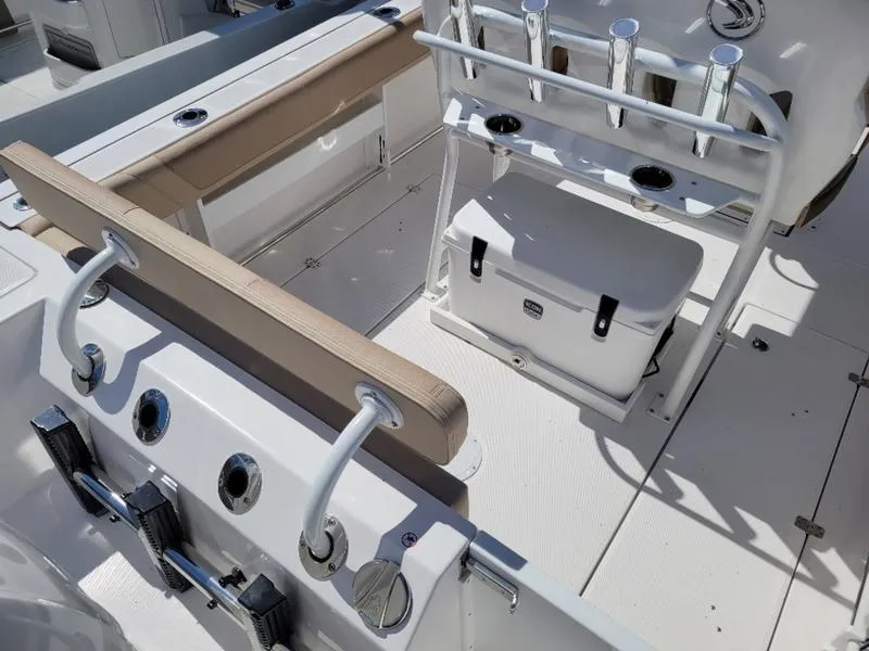 Slide: The Image of 2024 Edgewater 245 CC boat interior with seating and storage features. - 7