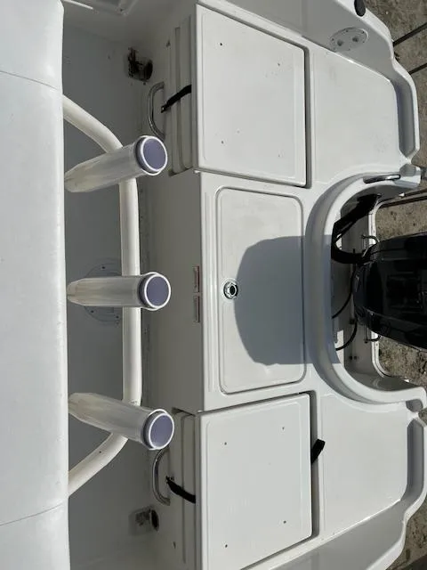 Slide: The Image of 2024 Bayliner Trophy T18Bay boat deck with rod holders and storage compartments. - 4