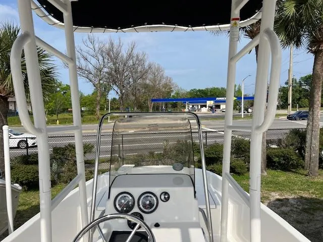 Slide: The Image of 2024 Bayliner Trophy T18Bay boat console with steering wheel and gauges. - 7