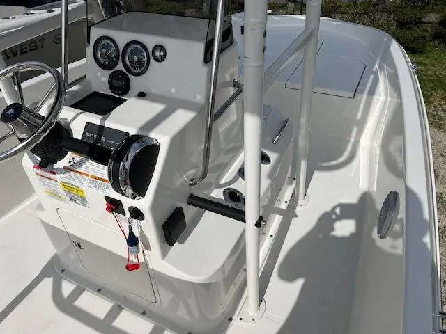 Slide: The Image of 2024 Bayliner Trophy T18Bay boat interior with steering console and gauges. - 9