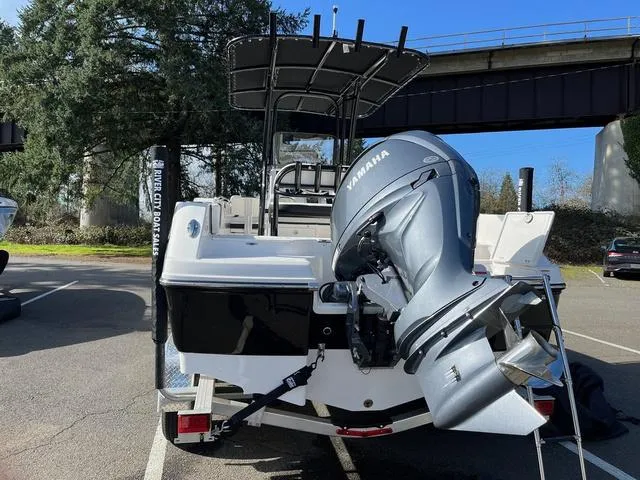 Slide: The Image of 2024 Robalo R200 boat with Yamaha outboard motor, parked outdoors. - 3