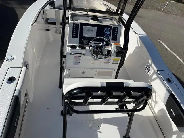 Slide: The Image of 2024 Robalo R200 boat interior with steering console and seating. - 4