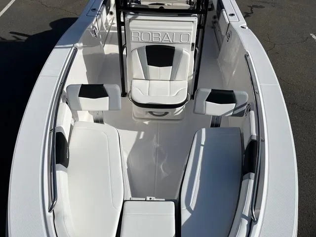 Slide: The Image of 2024 Robalo R200 boat interior with white seating and black accents. - 7