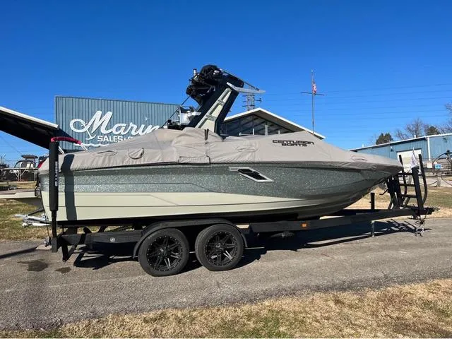 Slide: The Image of 2022 Centurion Ri230 boat on trailer at marina sales lot. - 14