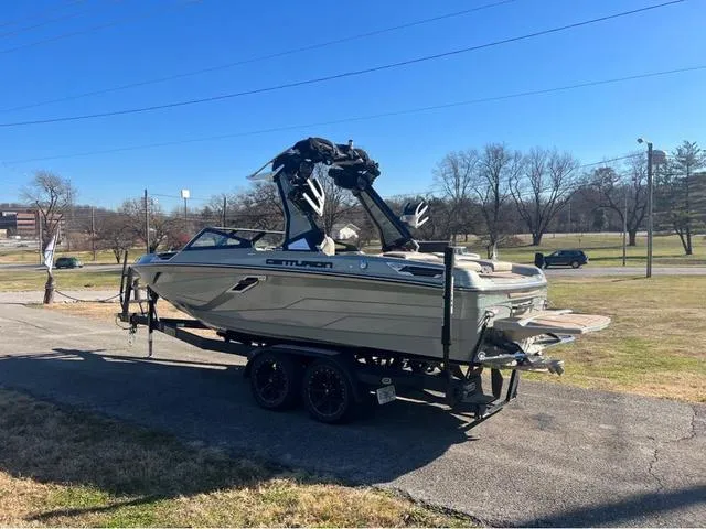 Slide: The Image of 2022 Centurion Ri230 boat on trailer in outdoor setting. - 5