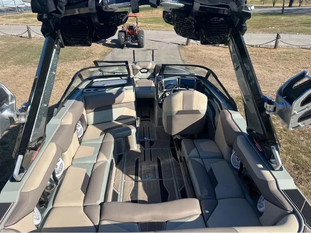 Slide: The Image of 2022 Centurion Ri230 boat interior with spacious seating and modern design. - 8