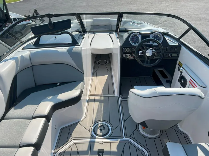 Slide: The Image of 2018 Moomba Mojo boat interior with sleek seating and modern dashboard design. - 10