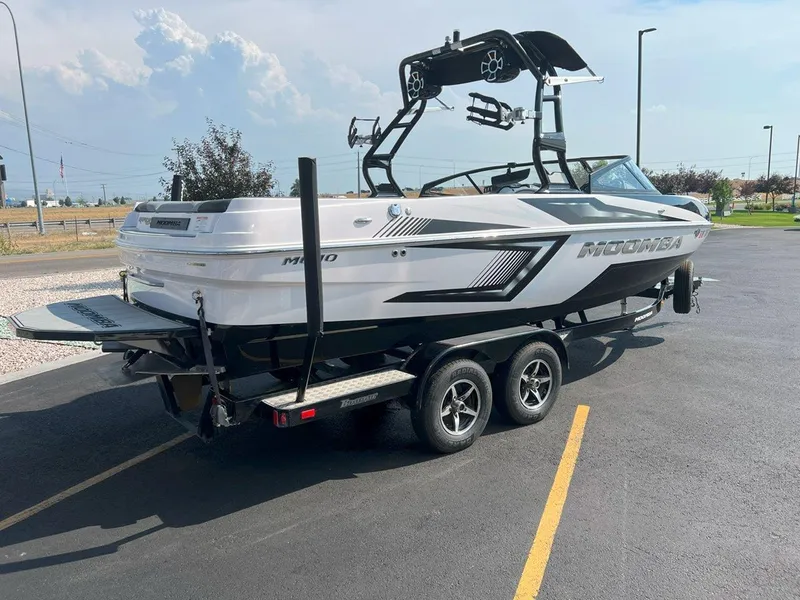Slide: The Image of 2018 Moomba Mojo boat on trailer in parking lot, rear view. - 6