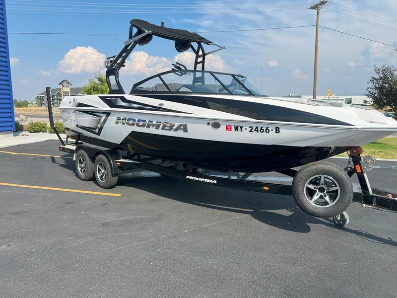 Slide: The Image of 2018 Moomba Mojo boat on trailer in parking lot, sunny day. - 8