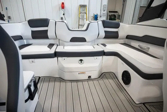 Slide: The Image of The image shows the interior of a 2024 Yamaha Boats 195S with gray and white seating. - 14