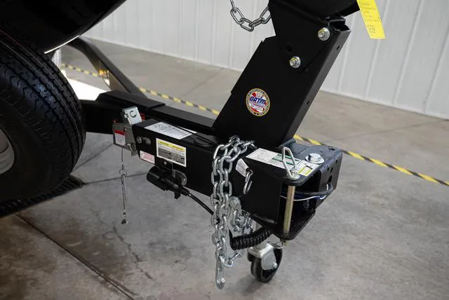 Slide: The Image of Close-up of a boat trailer with safety chains and a support wheel in a garage. - 23