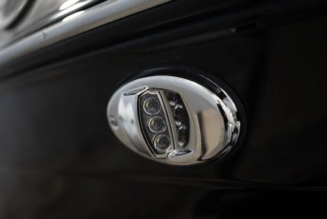 Slide: The Image of Close-up of a sleek, chrome boat light on a 2024 Yamaha 195S. - 20