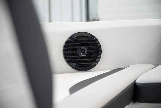 Slide: The Image of Close-up of a speaker in a modern boat, surrounded by white and gray upholstery. - 17