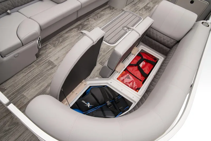 Slide: The Image of 2024 Ranger Reata 223C pontoon boat, side view of gate and seating area. - 16