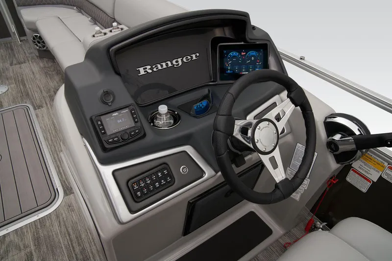 Slide: The Image of 2024 Ranger Reata 223C boat interior step with non-slip mat and carpeted flooring. - 36
