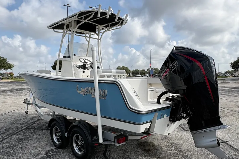 Slide: The Image of The image shows a 2024 Mako 214 Center Console boat on a trailer. - 3