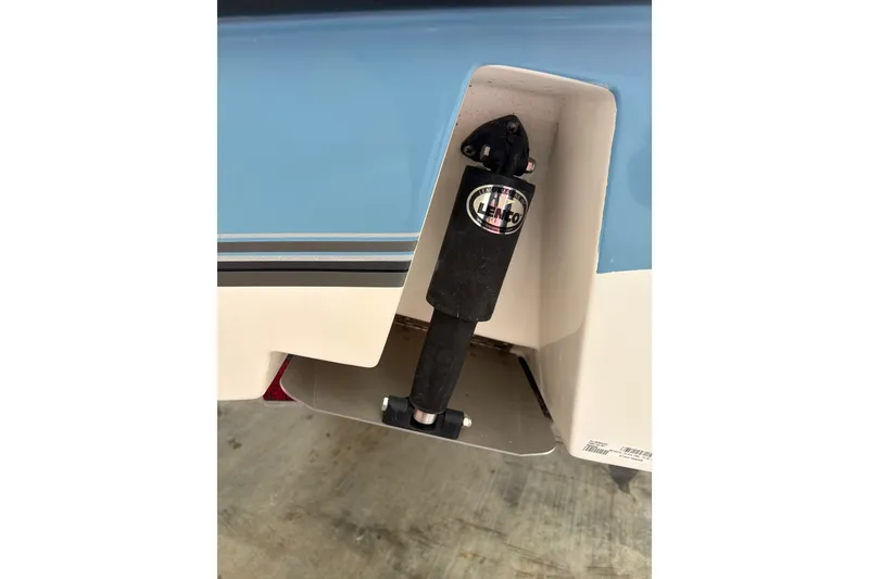 Slide: The Image of 2024 Mako 214 Center Console boat trim tab detail with Lenco actuator. - 16