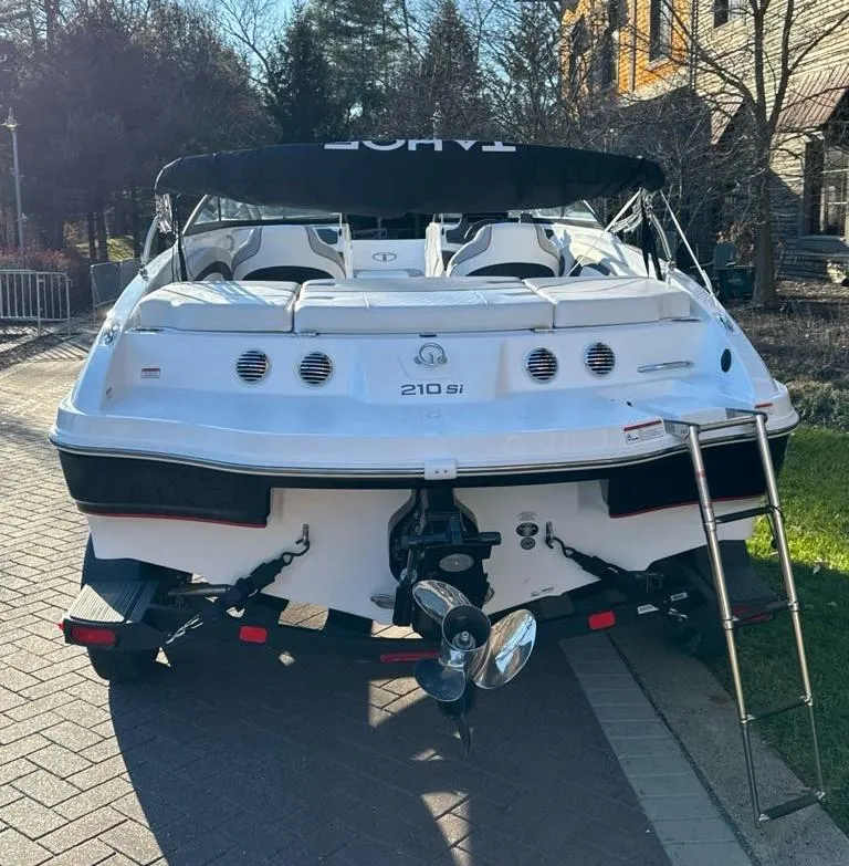 Slide: The Image of 2024 Tahoe 210 Si boat on a trailer, rear view. - 3