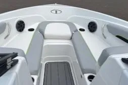 Slide: The Image of 2024 Tahoe 210 Si boat interior with gray and white seating. - 3