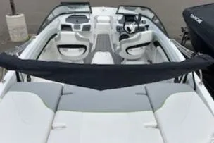 Slide: The Image of 2024 Tahoe 210 Si boat interior with white and gray seating. - 4