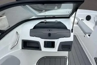 Slide: The Image of 2024 Tahoe 210 Si boat interior dashboard and seating area. - 6