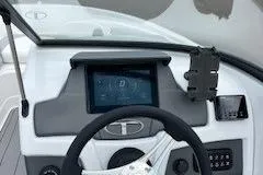 Slide: The Image of 2024 Tahoe 210 Si boat dashboard with modern controls and touchscreen display. - 7