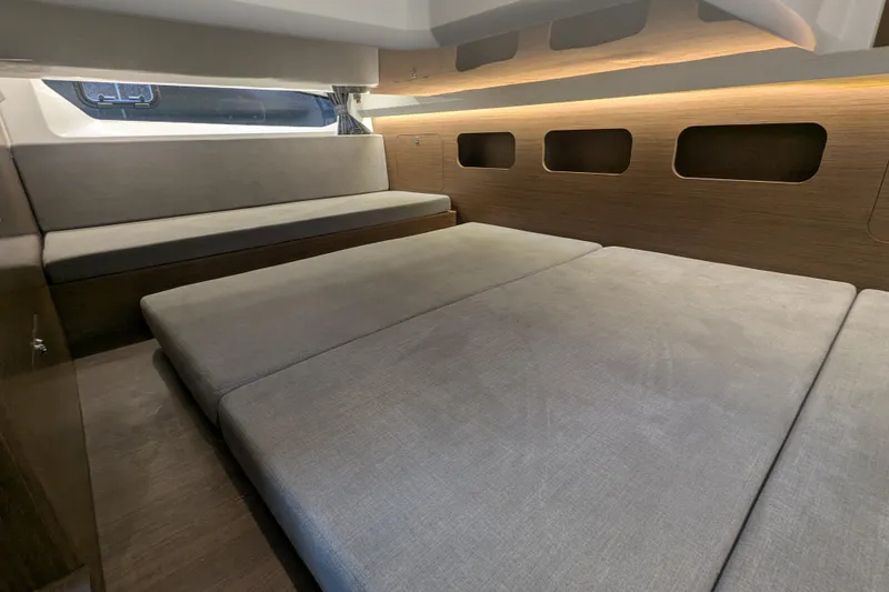 Slide: The Image of Interior cabin of 2024 Beneteau Antares 11, featuring modern seating and sleek design. - 13