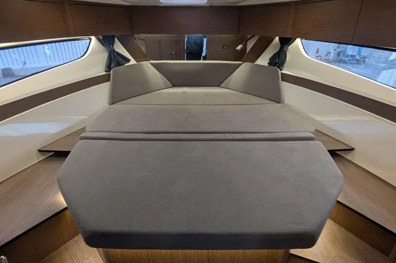 Slide: The Image of Interior cabin of 2024 Beneteau Antares 11 with comfortable seating and modern design. - 16
