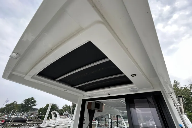 Slide: The Image of 2024 Beneteau Antares 11 boat roof with skylight and modern design. - 5