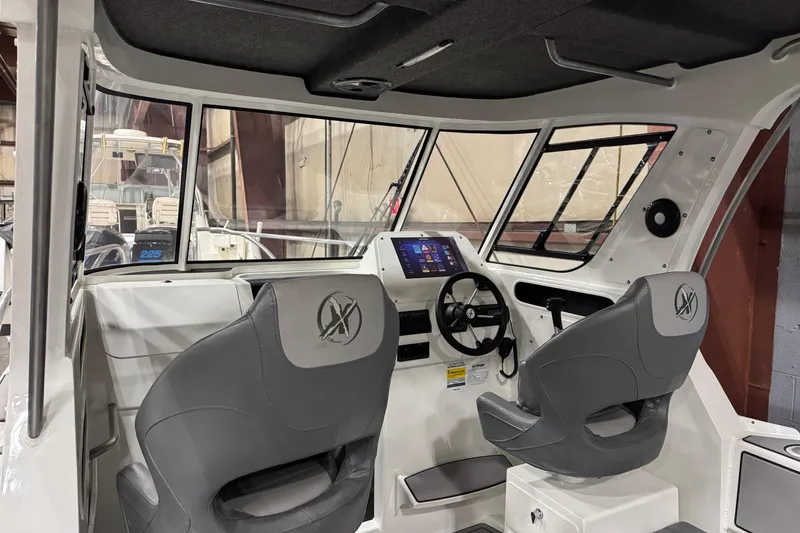 Slide: The Image of 2024 Extreme Boats 616 Game King interior with modern dashboard and seating. - 1