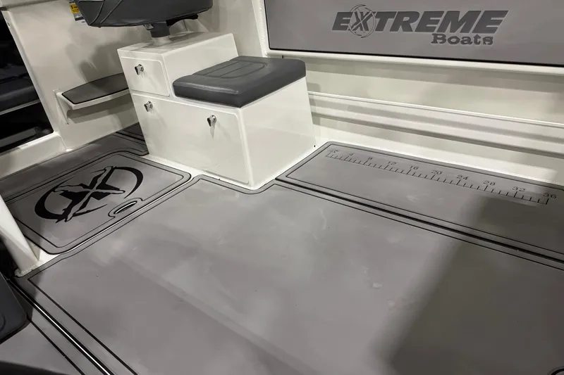 Slide: The Image of 2024 Extreme Boats 616 Game King interior with seating and branded flooring. - 10