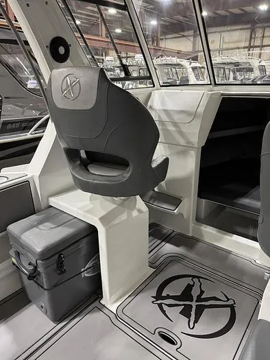 Slide: The Image of 2024 Extreme Boats 616 Game King interior with seating and storage. - 11