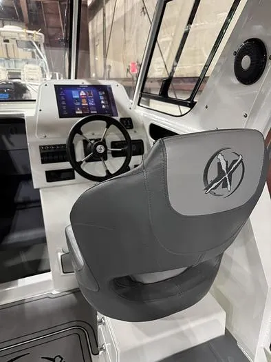 Slide: The Image of 2024 Extreme Boats 616 Game King cockpit with steering wheel and digital display. - 12