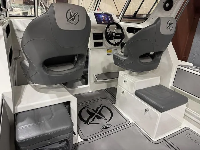 Slide: The Image of 2024 Extreme Boats 616 Game King interior with modern seating and control panel. - 2