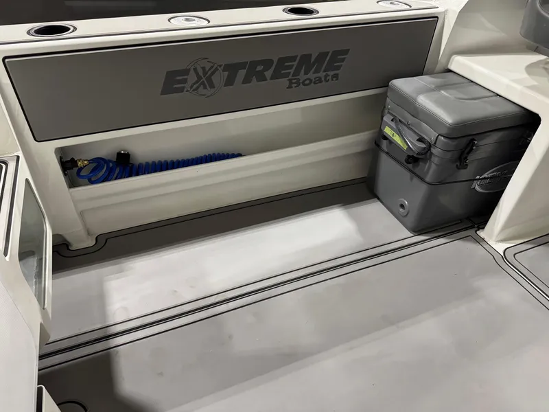 Slide: The Image of 2024 Extreme Boats 616 Game King interior with storage and cooler. - 5