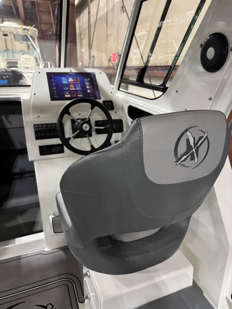 Slide: The Image of 2024 Extreme Boats 616 Game King cockpit with steering wheel and digital display. - 8
