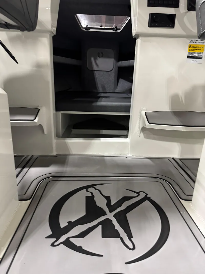Slide: The Image of 2024 Extreme Boats 616 Game King interior with custom flooring and seating. - 9