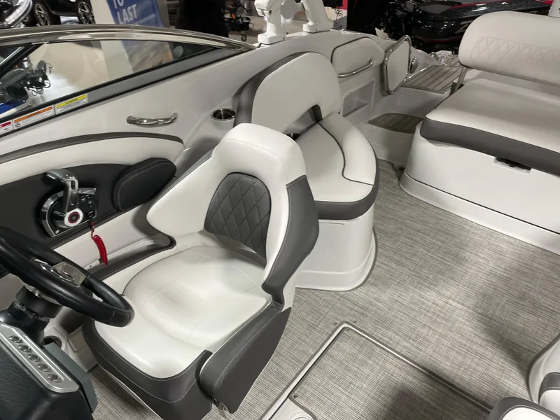 Slide: The Image of 2024 Crownline Eclipse E260 XS boat interior with luxurious seating and modern design. - 12