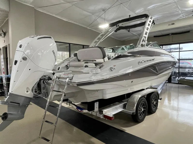 Slide: The Image of 2024 Crownline Eclipse E260 XS boat on trailer in showroom. - 4